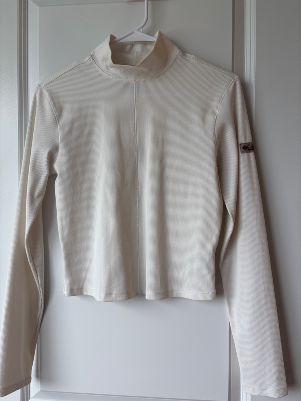 Women's Cream Mock Neck Long Sleeve Tee with Subtle Sleeve Patch